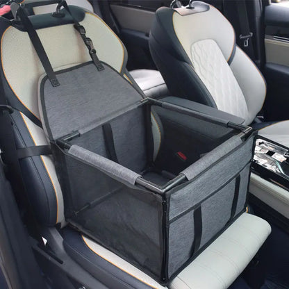 Dark grey SeatGuard foldable dog car booster seat installed on a car front seat