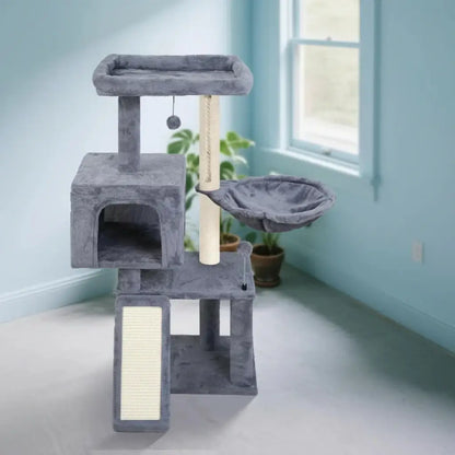Gray cat tree with multiple levels and a perch in a room with light blue walls and a window