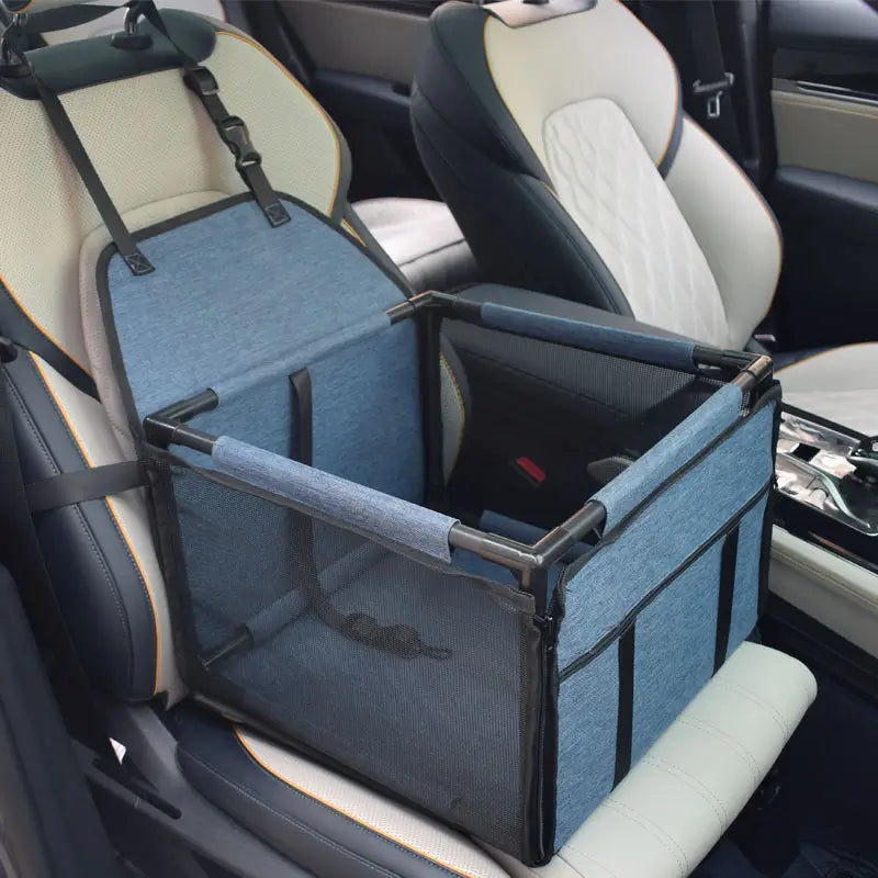 Navy blue SeatGuard foldable dog car booster seat installed on a car front seat