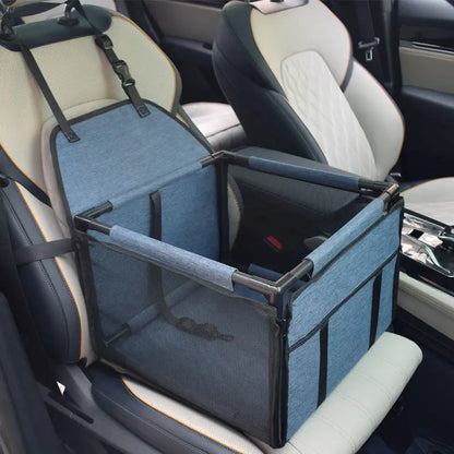 Navy blue SeatGuard foldable dog car booster seat installed on a car front seat