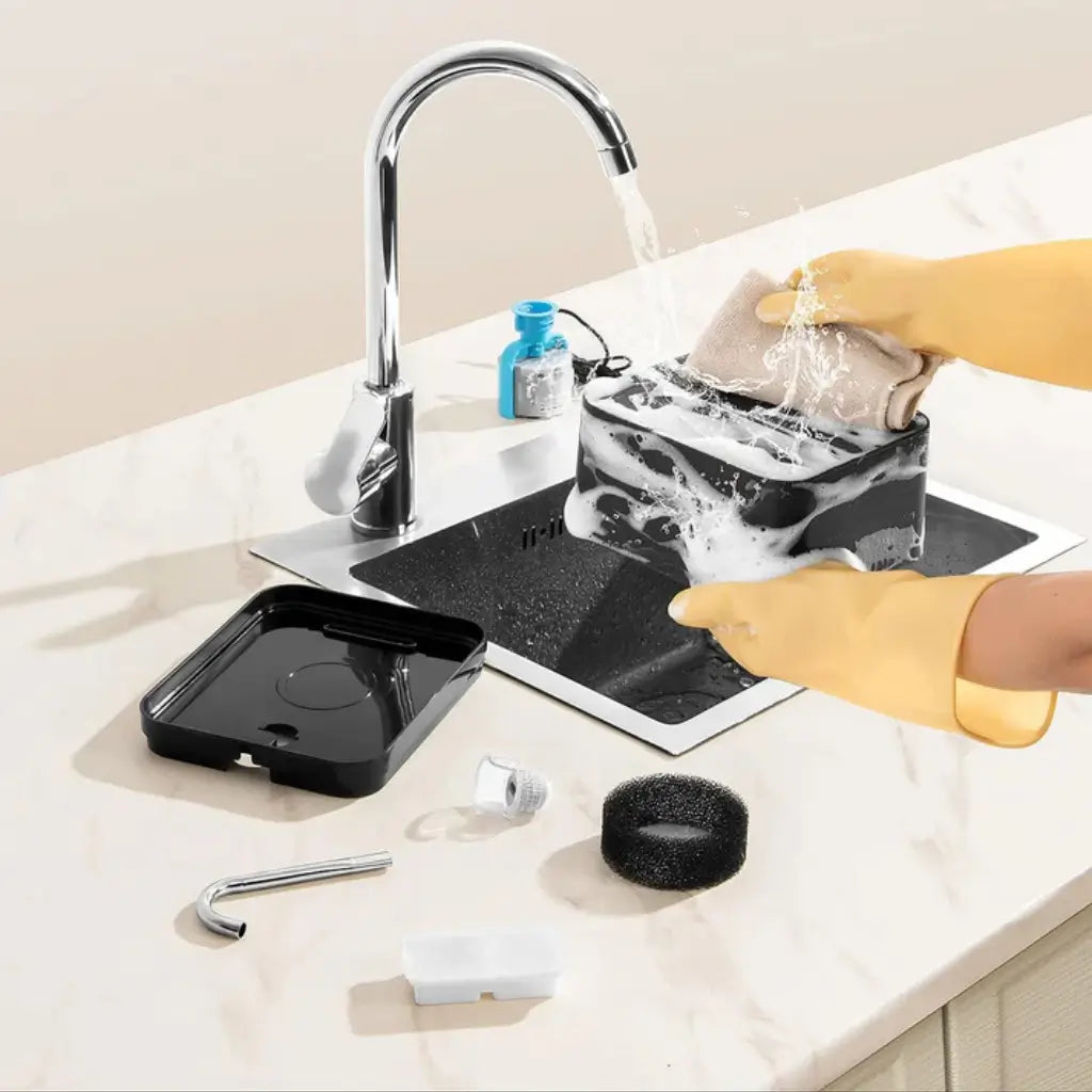 Person washing cat water fountain in a kitchen sink with various water fountain parts around
