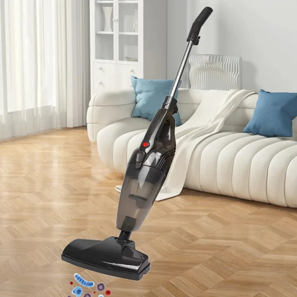 Vacuum cleaner cleaning a wooden floor in a living room with a white sofa and blue pillows