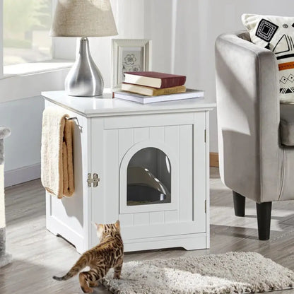 White cat litter box with a cat looking through it, placed in a living room.