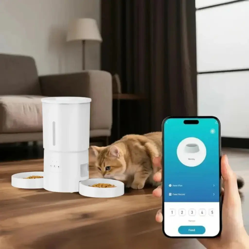 Smart white pet feeder with a cat eating and a phone app displayed