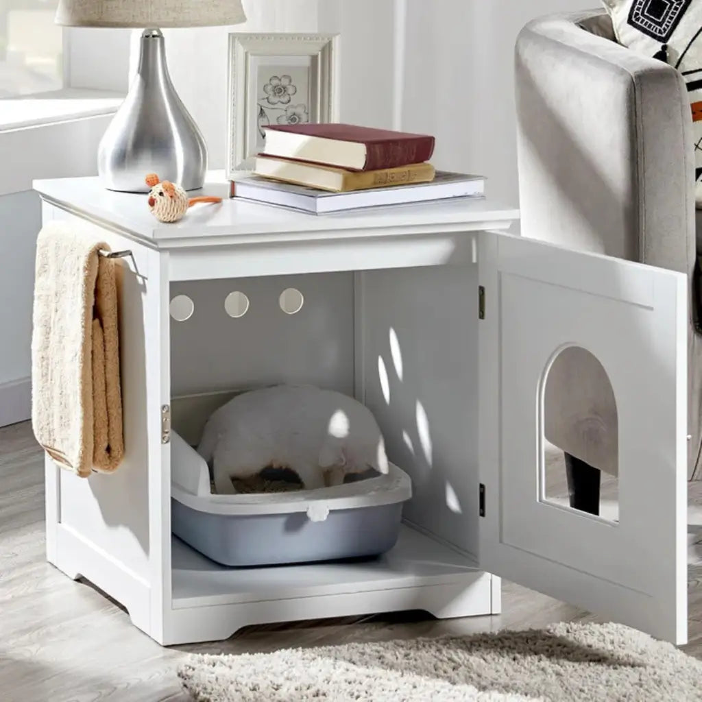 White pet litter box enclosure with a cat inside, placed on a white surface.