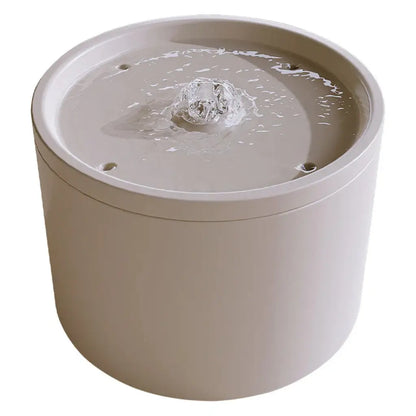 white ceramic cat water fountain on a white background